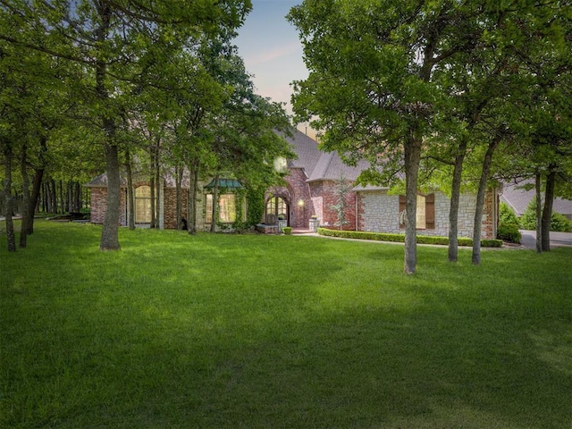 3125 Cumberland Dr, Edmond, OK 73034 - yard at dusk with a yard