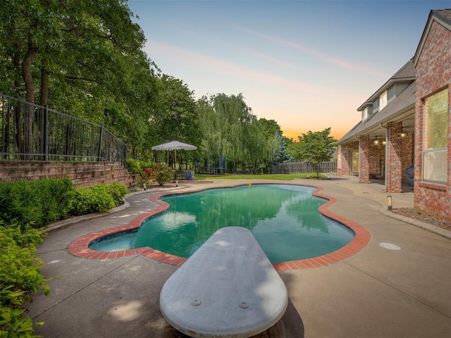 3125 Cumberland Dr, Edmond, OK 73034 - view of swimming pool with a patio, a fenced backyard, and a diving board