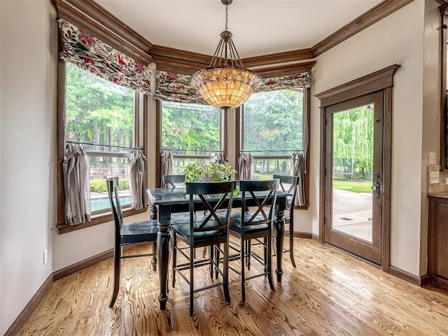 3125 Cumberland Dr, Edmond, OK 73034 - dining room with ornamental molding, healthy amount of natural light, light wood-style floors, and baseboards
