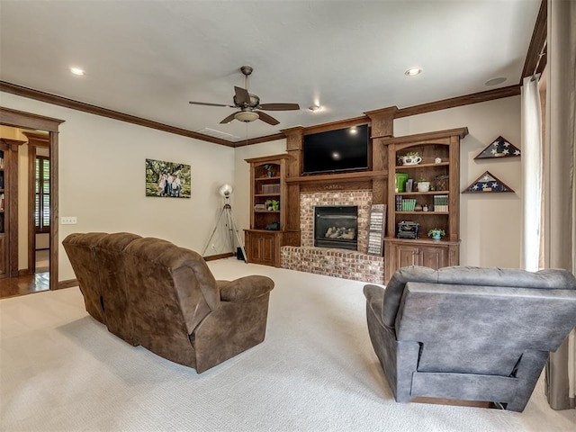 3125 Cumberland Dr, Edmond, OK 73034 - living room featuring light colored carpet, ceiling fan, a brick fireplace, crown molding, and baseboards