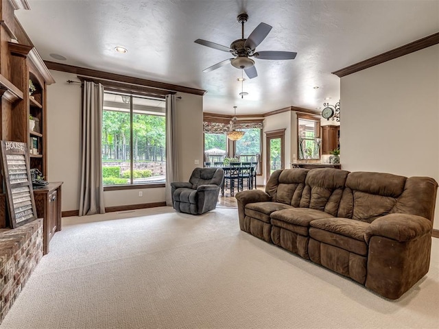 3125 Cumberland Dr, Edmond, OK 73034 - living room with ornamental molding, light carpet, ceiling fan, and baseboards