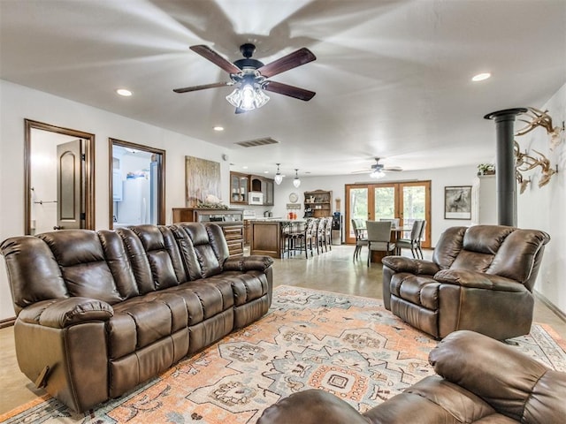 living area featuring recessed lighting, ceiling fan, visible vents, and baseboards