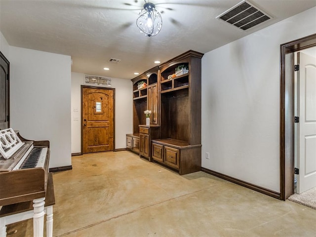 mudroom with baseboards, concrete flooring, recessed lighting, and visible vents