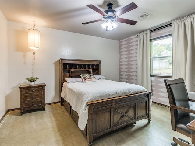 bedroom featuring baseboards, ceiling fan, and visible vents
