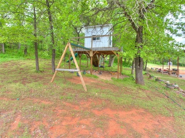 view of yard with a deck and stairs