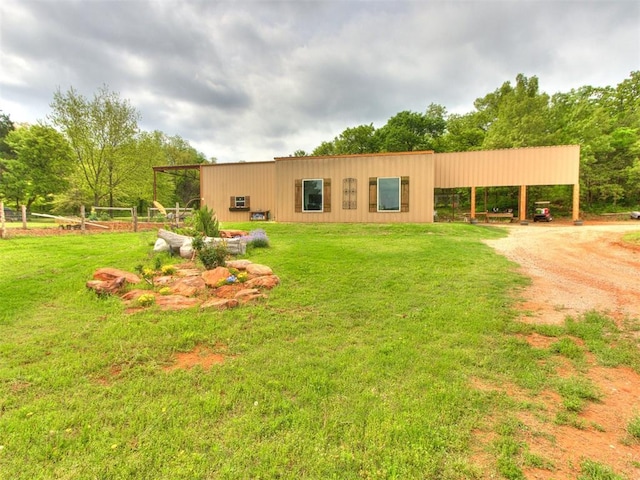 rear view of house with a yard