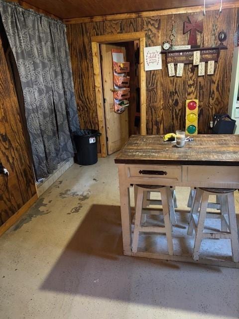dining space with wood walls