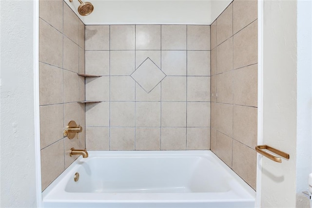 full bathroom with shower / bath combination and a textured wall