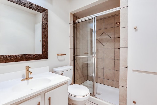 full bath featuring toilet, a shower stall, and vanity
