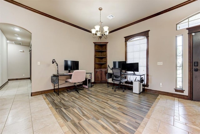 home office with crown molding, visible vents, baseboards, arched walkways, and light tile patterned floors