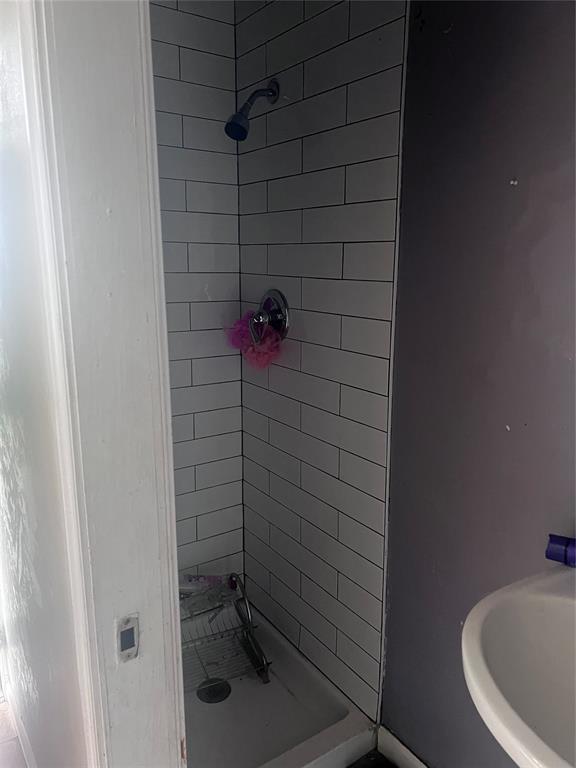 bathroom with a shower stall