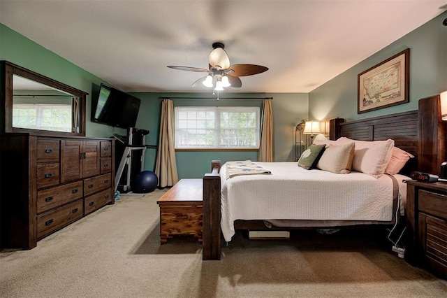 carpeted bedroom with a ceiling fan
