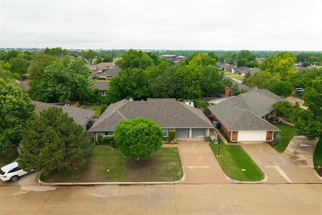 birds eye view of property with a residential view