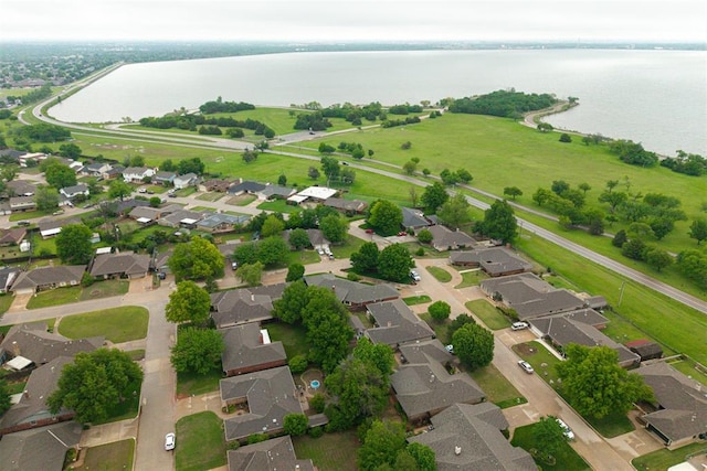 aerial view with a water view and a residential view
