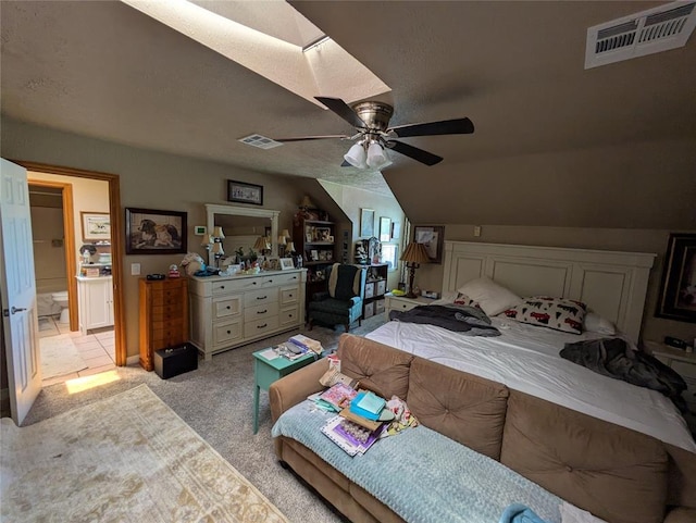 900 Walnut Pl, Norman, OK 73072 - bedroom with light carpet, lofted ceiling, and ceiling fan