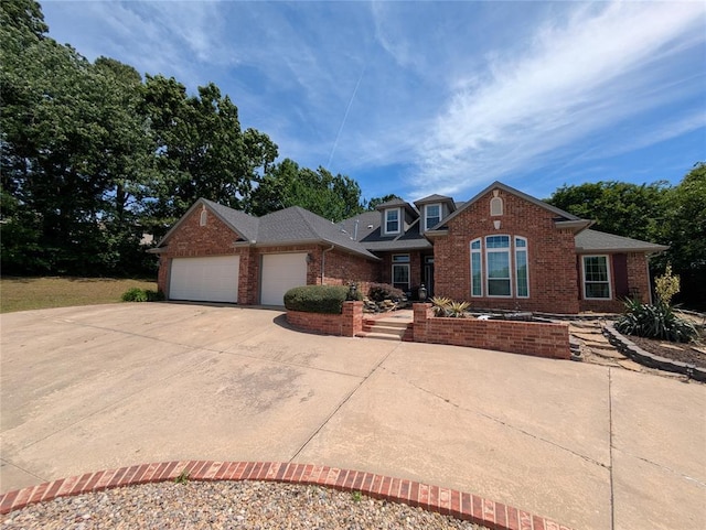 900 Walnut Pl, Norman, OK 73072 - traditional-style house featuring an attached garage, brick siding, and concrete driveway