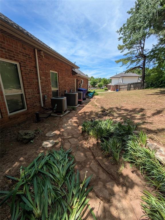 900 Walnut Pl, Norman, OK 73072 - view of yard featuring central AC unit and fence