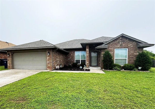 view of front of home with a front yard, brick siding, a shingled roof, concrete driveway, and an attached garage