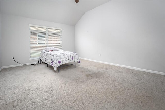 1208 Hickory Creek Dr, Yukon, OK 73099 - bedroom with lofted ceiling, baseboards, carpet flooring, and a ceiling fan