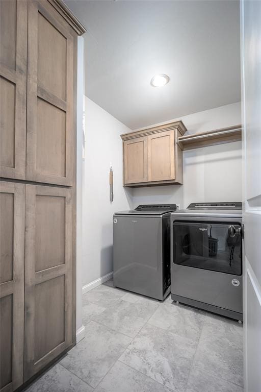 1208 Hickory Creek Dr, Yukon, OK 73099 - clothes washing area with cabinet space, washing machine and clothes dryer, and baseboards