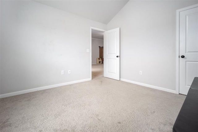 1208 Hickory Creek Dr, Yukon, OK 73099 - unfurnished bedroom featuring baseboards, light colored carpet, and vaulted ceiling