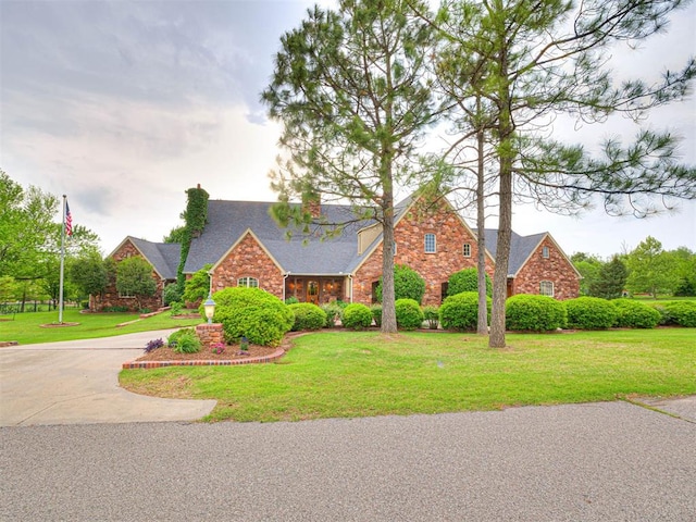 3812 Ridgeline Dr, Norman, OK 73072 - view of front of house featuring stone siding, driveway, and a front yard