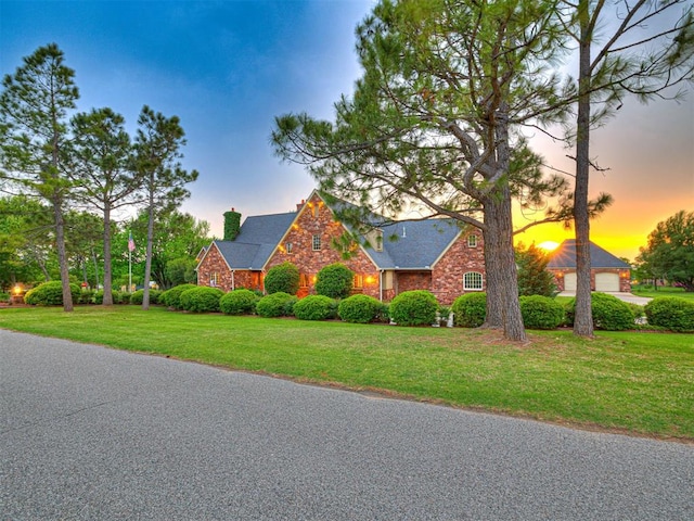 3812 Ridgeline Dr, Norman, OK 73072 - view of front of home featuring a chimney, stone siding, and a front yard