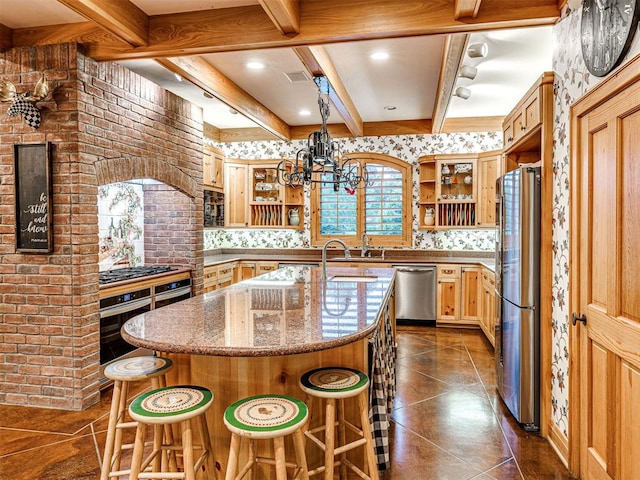 3812 Ridgeline Dr, Norman, OK 73072 - kitchen with stainless steel appliances, a wealth of natural light, light stone counters, and beam ceiling