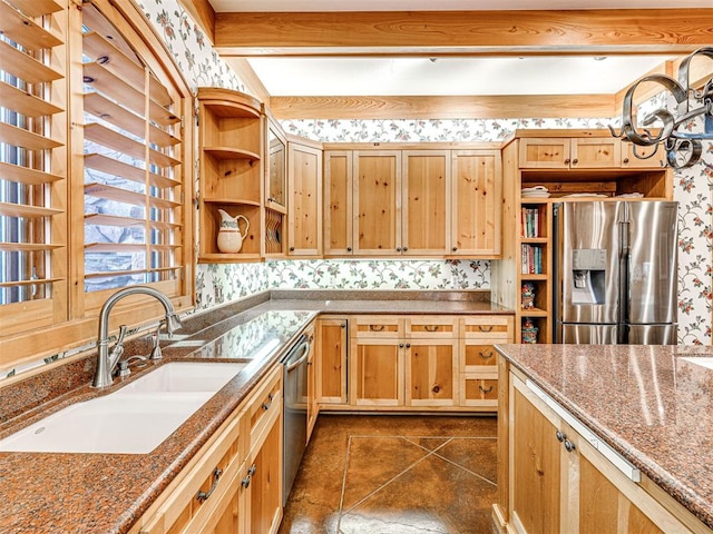 3812 Ridgeline Dr, Norman, OK 73072 - kitchen featuring a sink, dark stone counters, open shelves, wallpapered walls, and appliances with stainless steel finishes