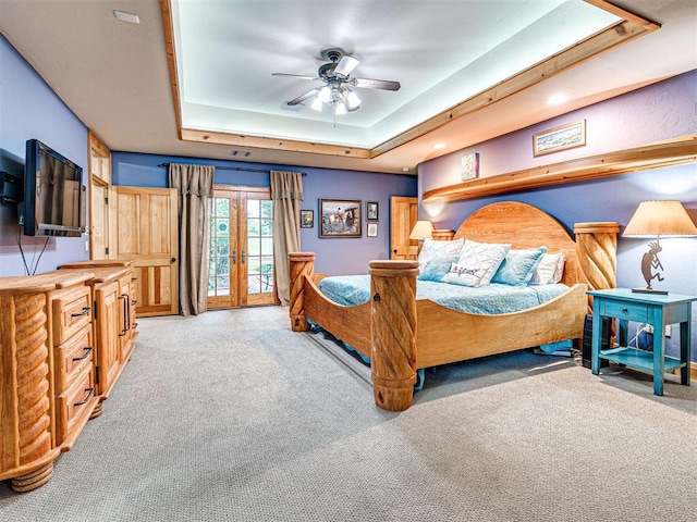 3812 Ridgeline Dr, Norman, OK 73072 - bedroom featuring carpet flooring, access to outside, a ceiling fan, and a tray ceiling