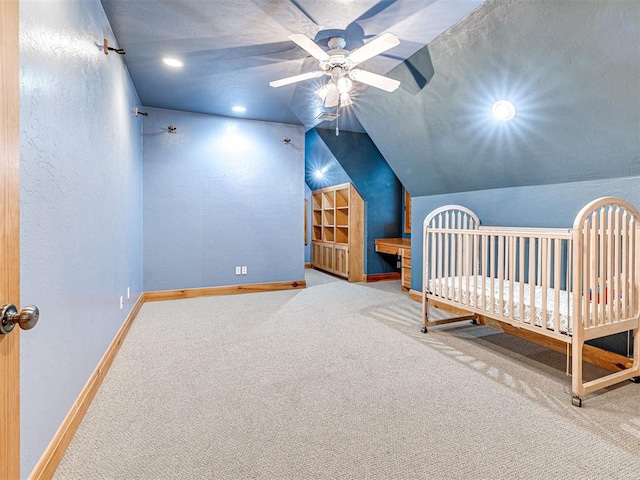 3812 Ridgeline Dr, Norman, OK 73072 - carpeted bedroom with a ceiling fan, recessed lighting, baseboards, vaulted ceiling, and a textured wall