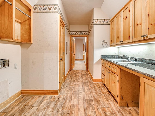 3812 Ridgeline Dr, Norman, OK 73072 - clothes washing area with washer hookup, light wood-style flooring, cabinet space, and a sink