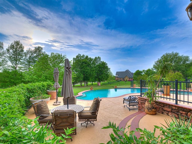 3812 Ridgeline Dr, Norman, OK 73072 - view of swimming pool with a patio area, a fenced in pool, and fence