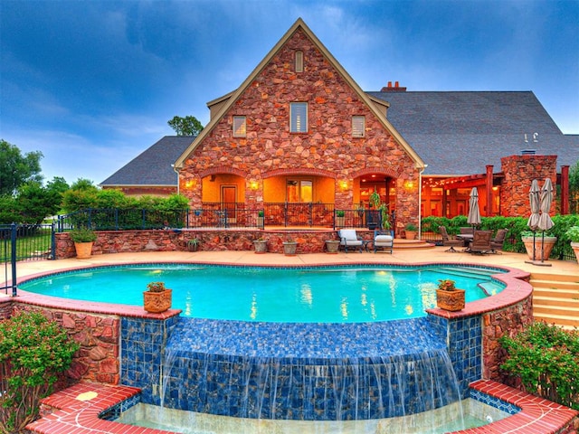 3812 Ridgeline Dr, Norman, OK 73072 - view of swimming pool featuring a pool with connected hot tub, fence, and a patio area