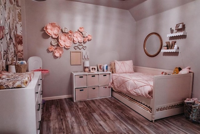 bedroom featuring dark wood-type flooring and baseboards