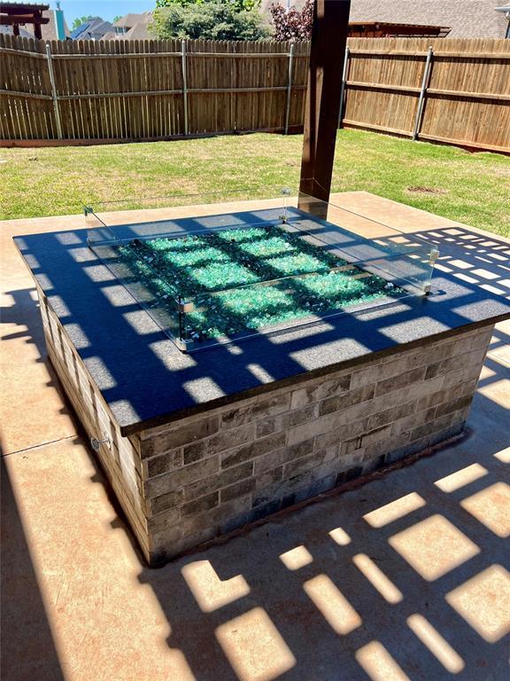view of pool with a yard and fence