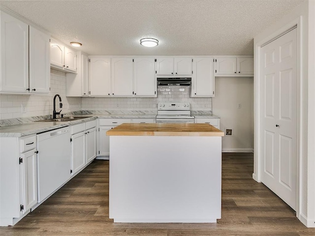 kitchen featuring a sink, white appliances, and white cabinetry