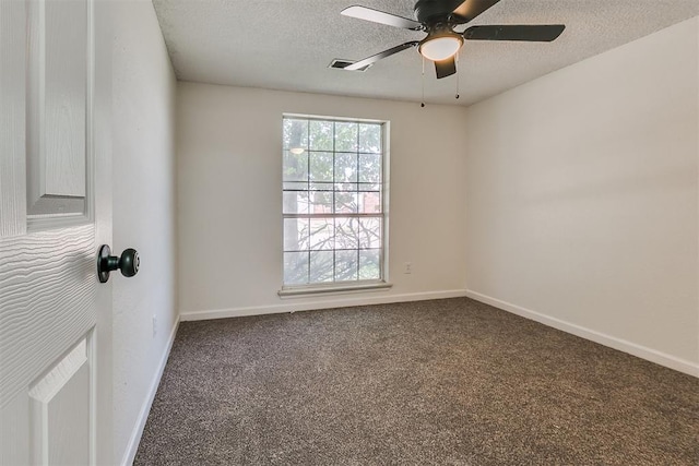 unfurnished room featuring carpet floors, a textured ceiling, ceiling fan, and baseboards