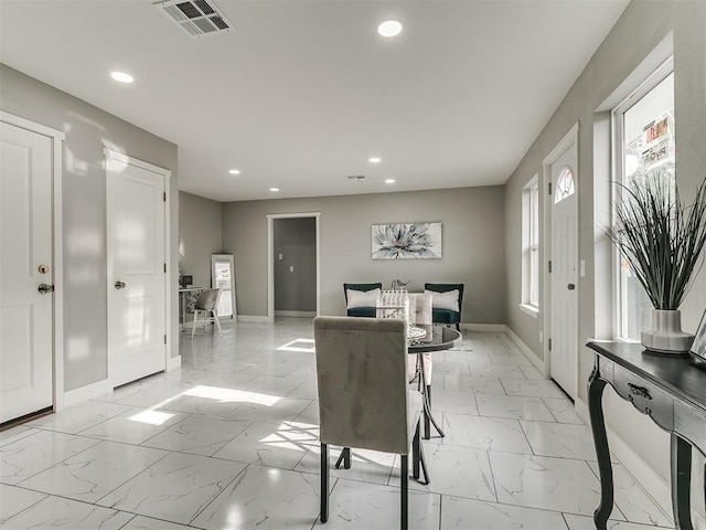 interior space featuring visible vents, recessed lighting, marble finish floor, and baseboards