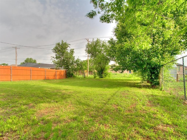 view of yard featuring fence