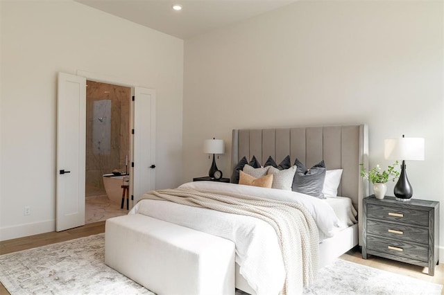 2826 Guilford Ln, Oklahoma City, OK 73120 - bedroom featuring wood finished floors, baseboards, recessed lighting, and ensuite bathroom