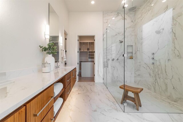 2826 Guilford Ln, Oklahoma City, OK 73120 - full bath with a marble finish shower, marble tiled floors, vanity, a walk in closet, and recessed lighting
