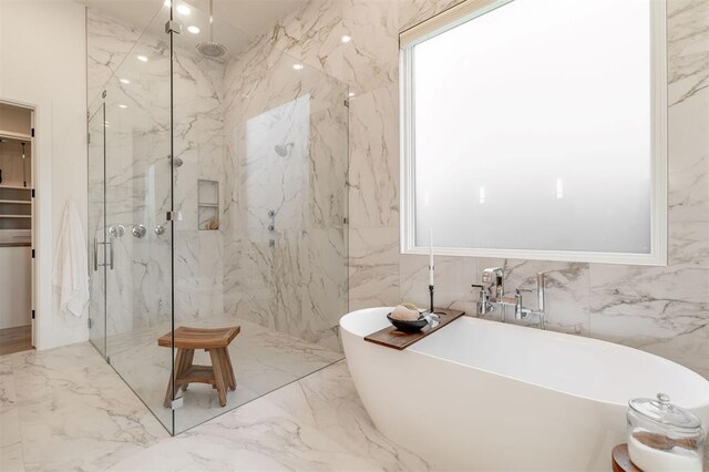 2826 Guilford Ln, Oklahoma City, OK 73120 - full bathroom featuring a marble finish shower, a freestanding tub, marble tiled flooring, and tile walls