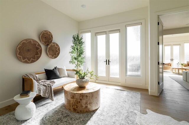 2826 Guilford Ln, Oklahoma City, OK 73120 - living area featuring french doors, wood finished floors, and baseboards