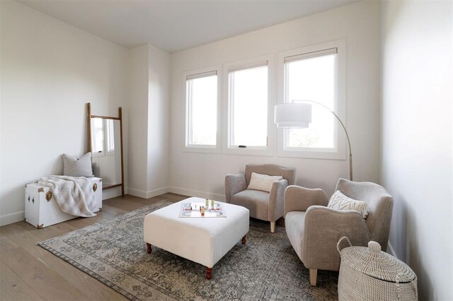 2826 Guilford Ln, Oklahoma City, OK 73120 - sitting room with wood finished floors and baseboards
