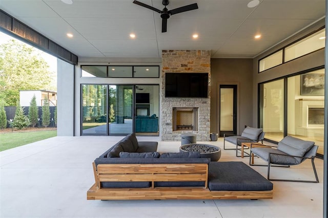2826 Guilford Ln, Oklahoma City, OK 73120 - view of patio featuring an outdoor living space with a fireplace and a ceiling fan