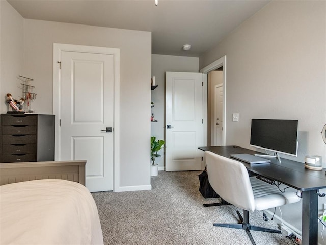 carpeted bedroom featuring baseboards