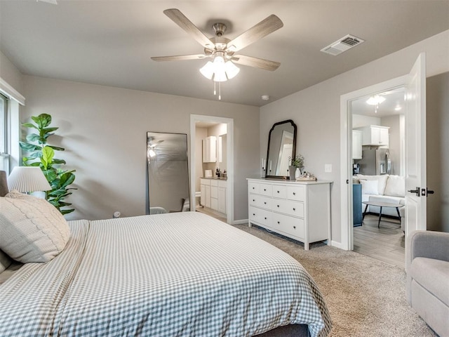 bedroom with visible vents, light carpet, baseboards, ceiling fan, and stainless steel fridge with ice dispenser