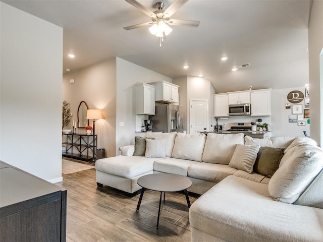 living area featuring ceiling fan, recessed lighting, baseboards, light wood-type flooring, and visible vents
