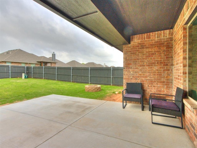 view of patio / terrace featuring a fire pit and a fenced backyard